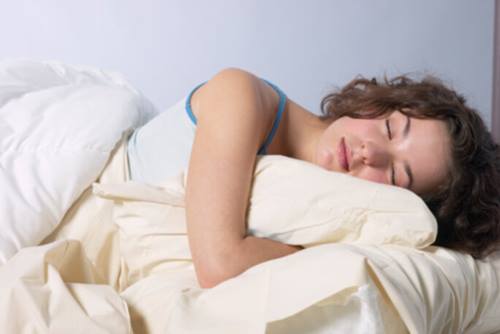 Side Sleeper with arms wrapped around a pillow 